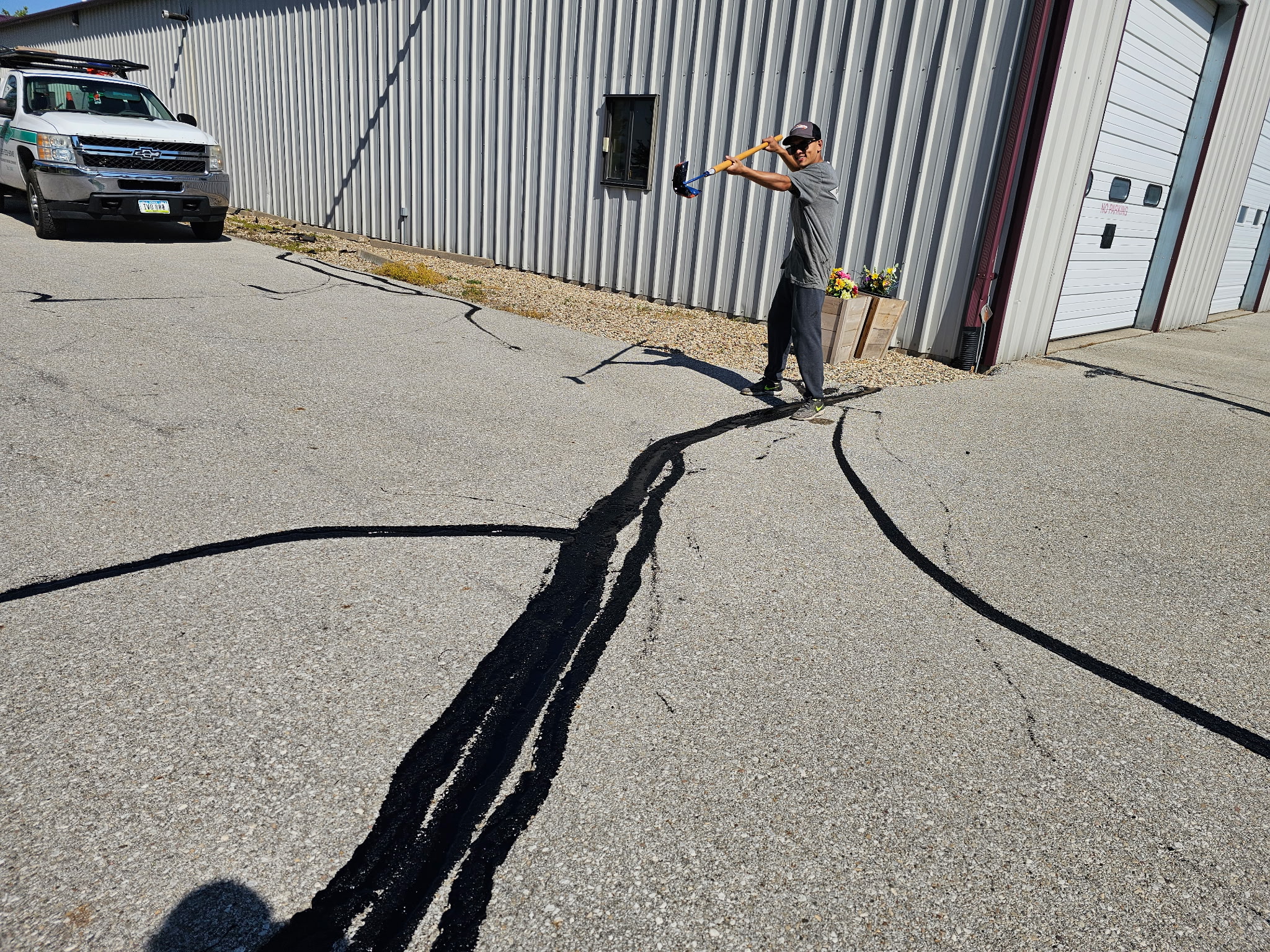 Commercial parking lot maintenance in Blue Grass, Quad Cities by Behncke Construction