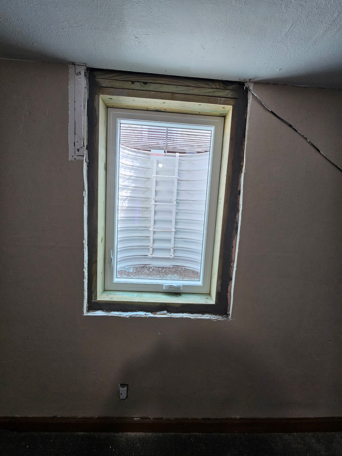 Egress window installation work in Rock Island, Illinois by Behncke Construction