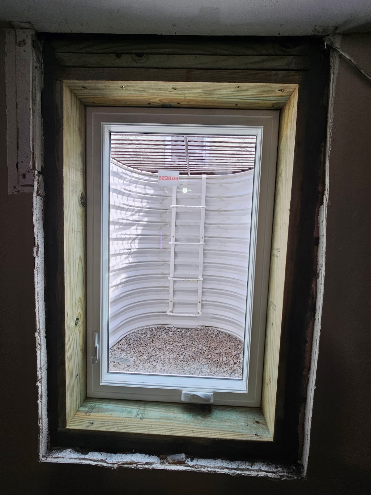 Finished egress window well and cover in Rock Island, Illinois