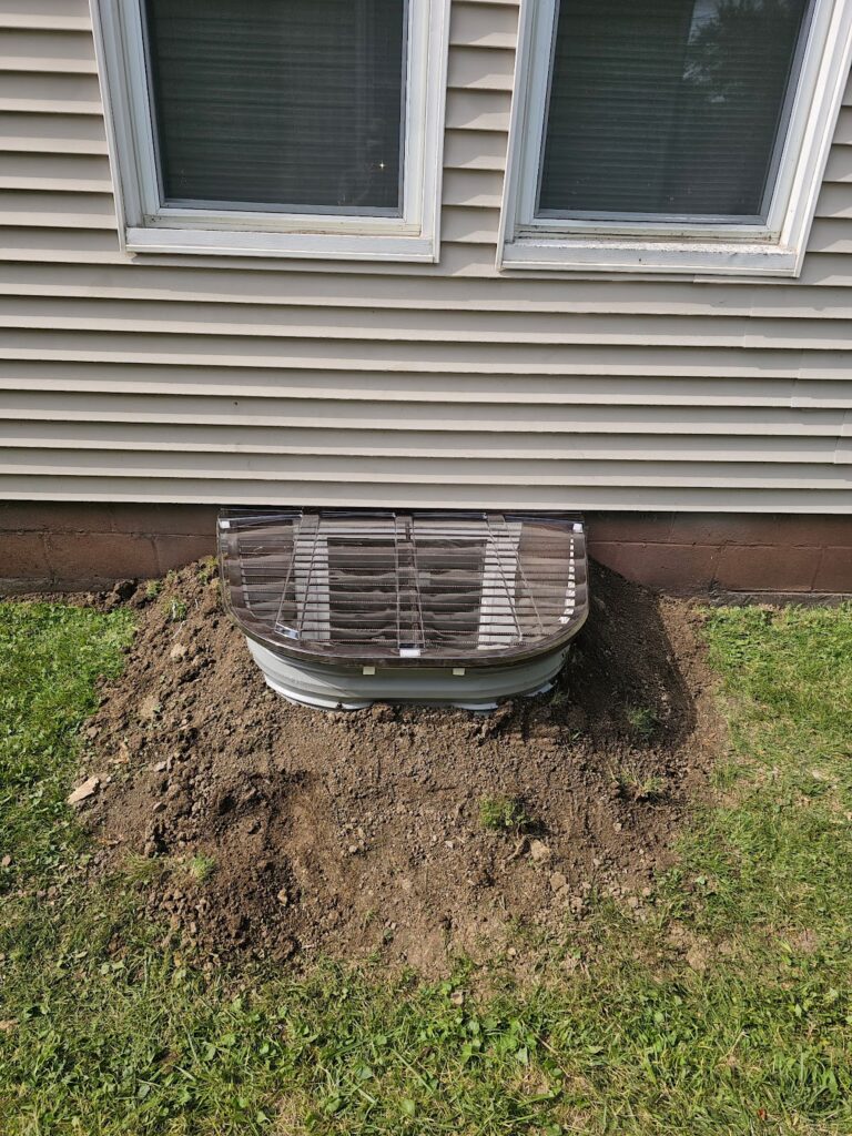 Completed egress window installation in Rock Island, Illinois by Behncke Construction
