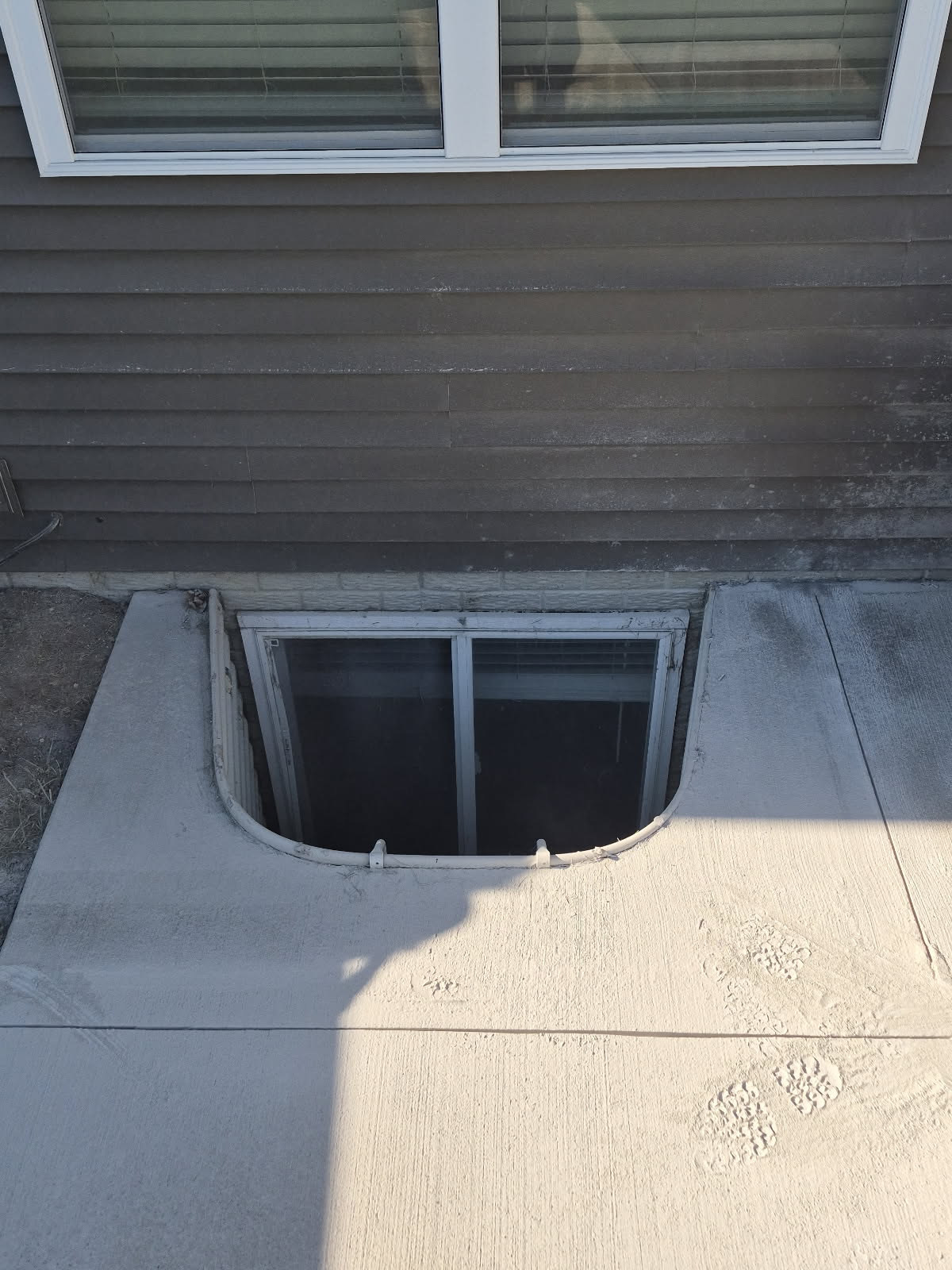 Leaking egress window corrected in the Quad Cities by Behncke Construction 1