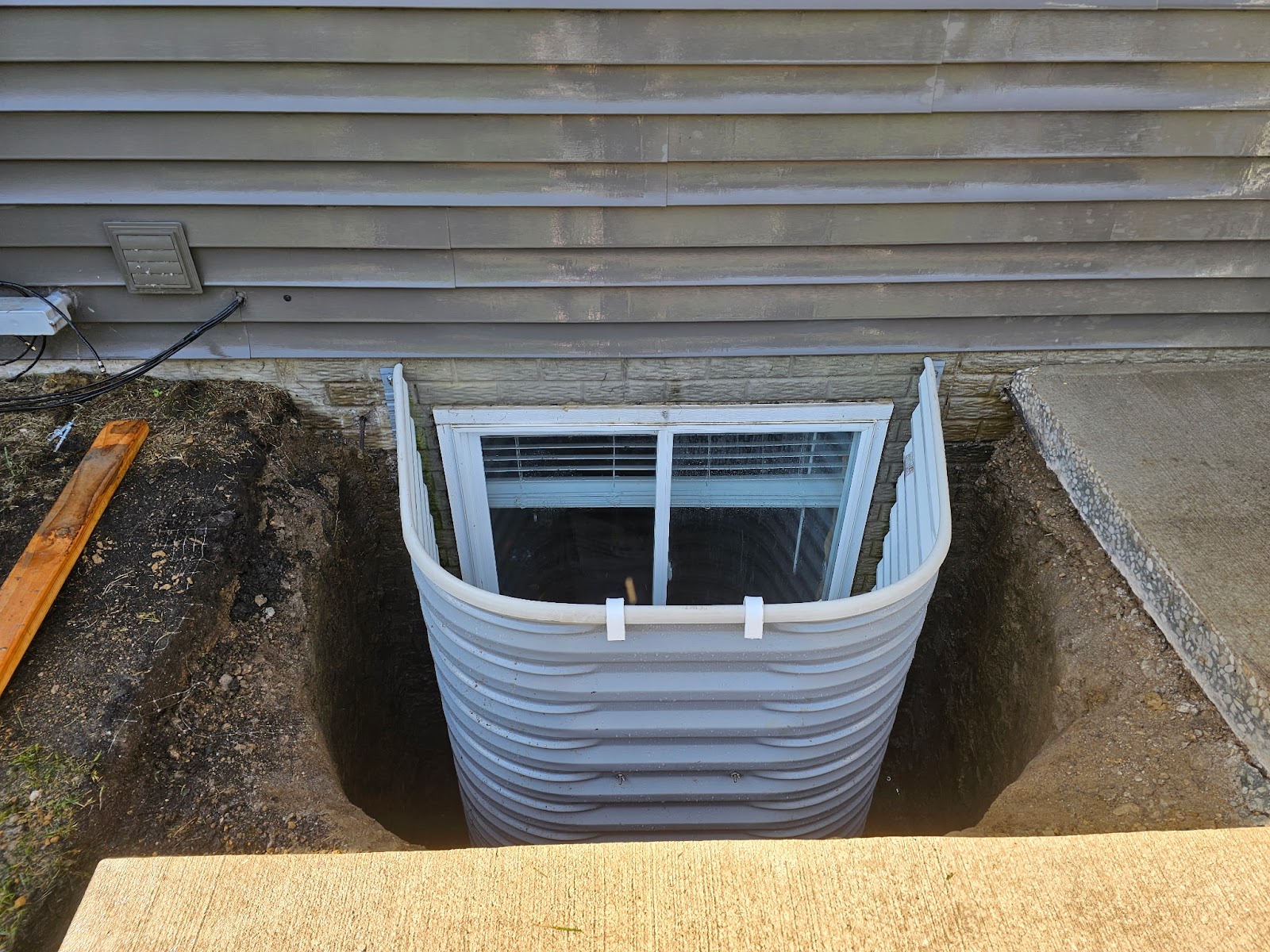 Leaking egress window corrected in the Quad Cities by Behncke Construction 5