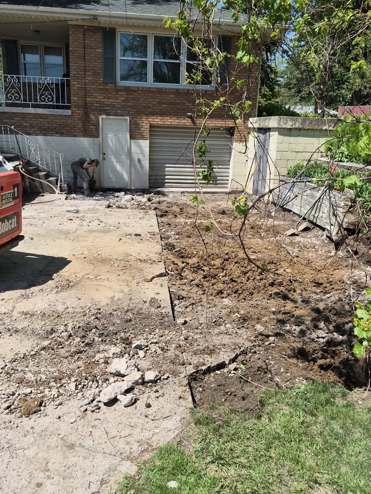 Concrete driveway and retaining wall repair in Davenport, Iowa by Behncke Construction 1