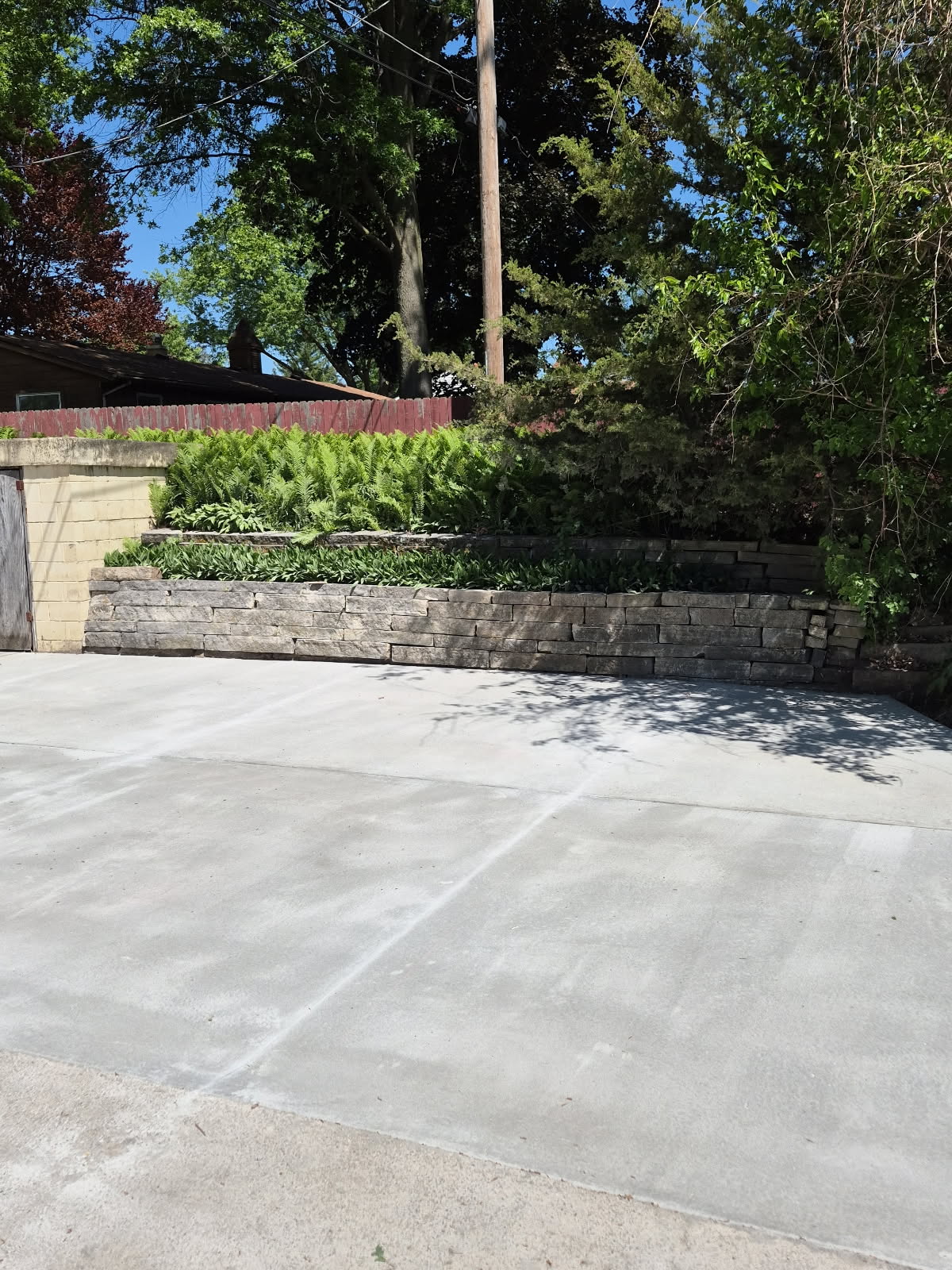 Concrete driveway and retaining wall repair in Davenport, Iowa by Behncke Construction 7