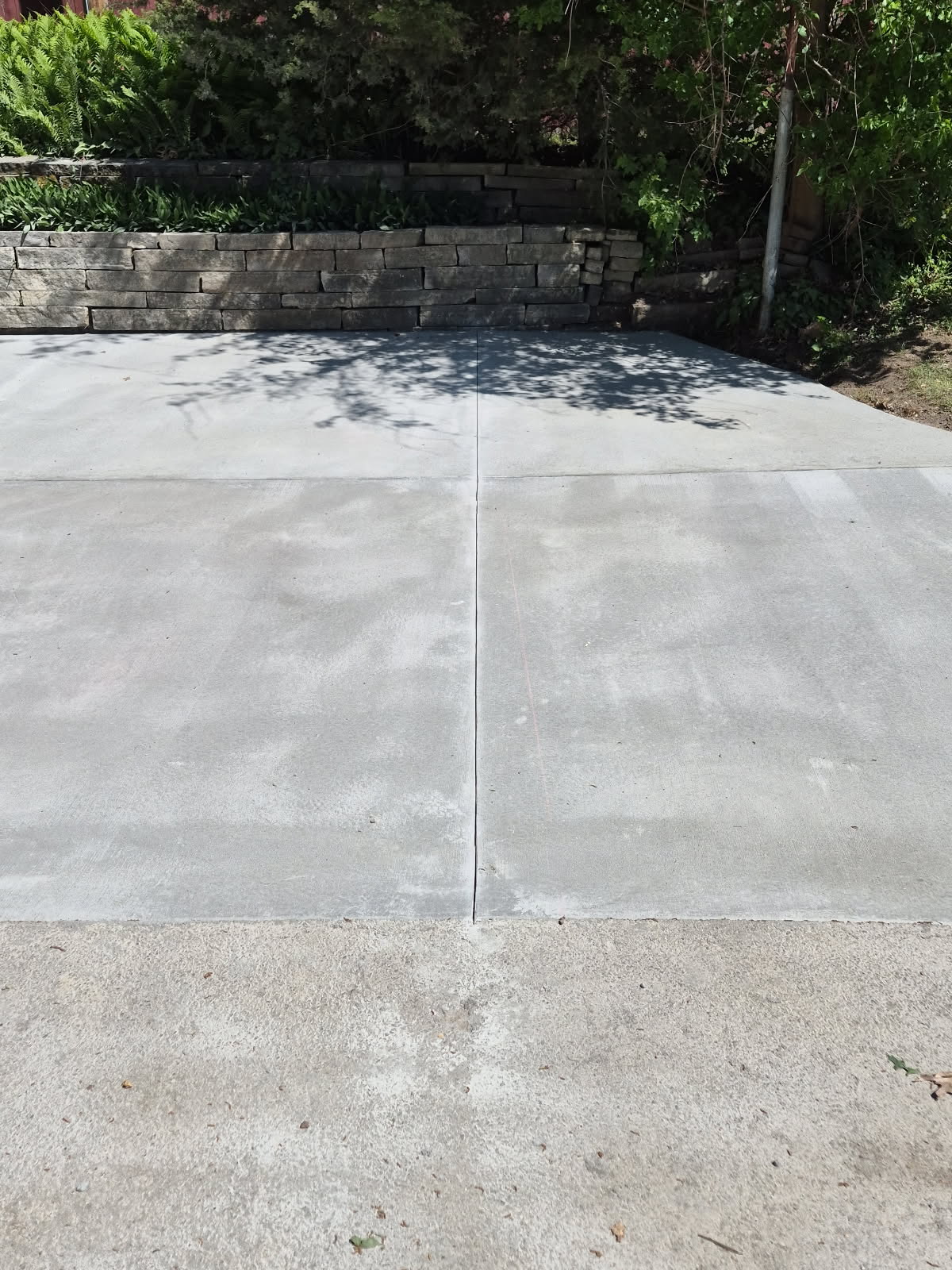 Concrete driveway and retaining wall repair in Davenport, Iowa by Behncke Construction 8