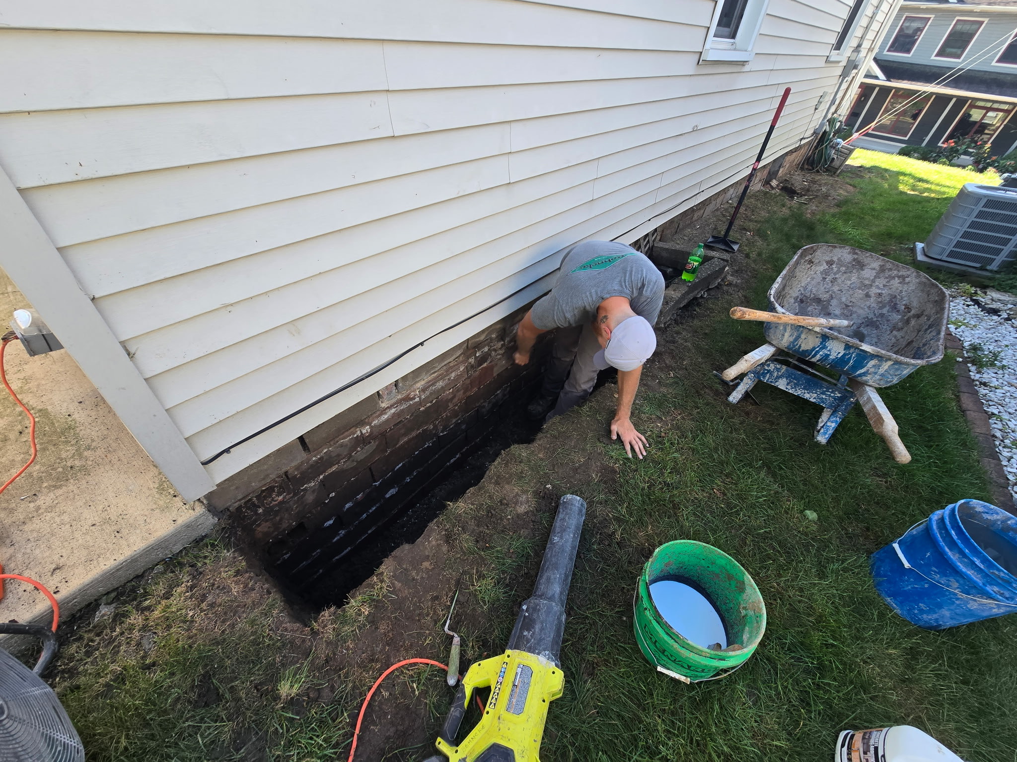 Exterior foundation excavation and waterproofing to stop frost-driving water