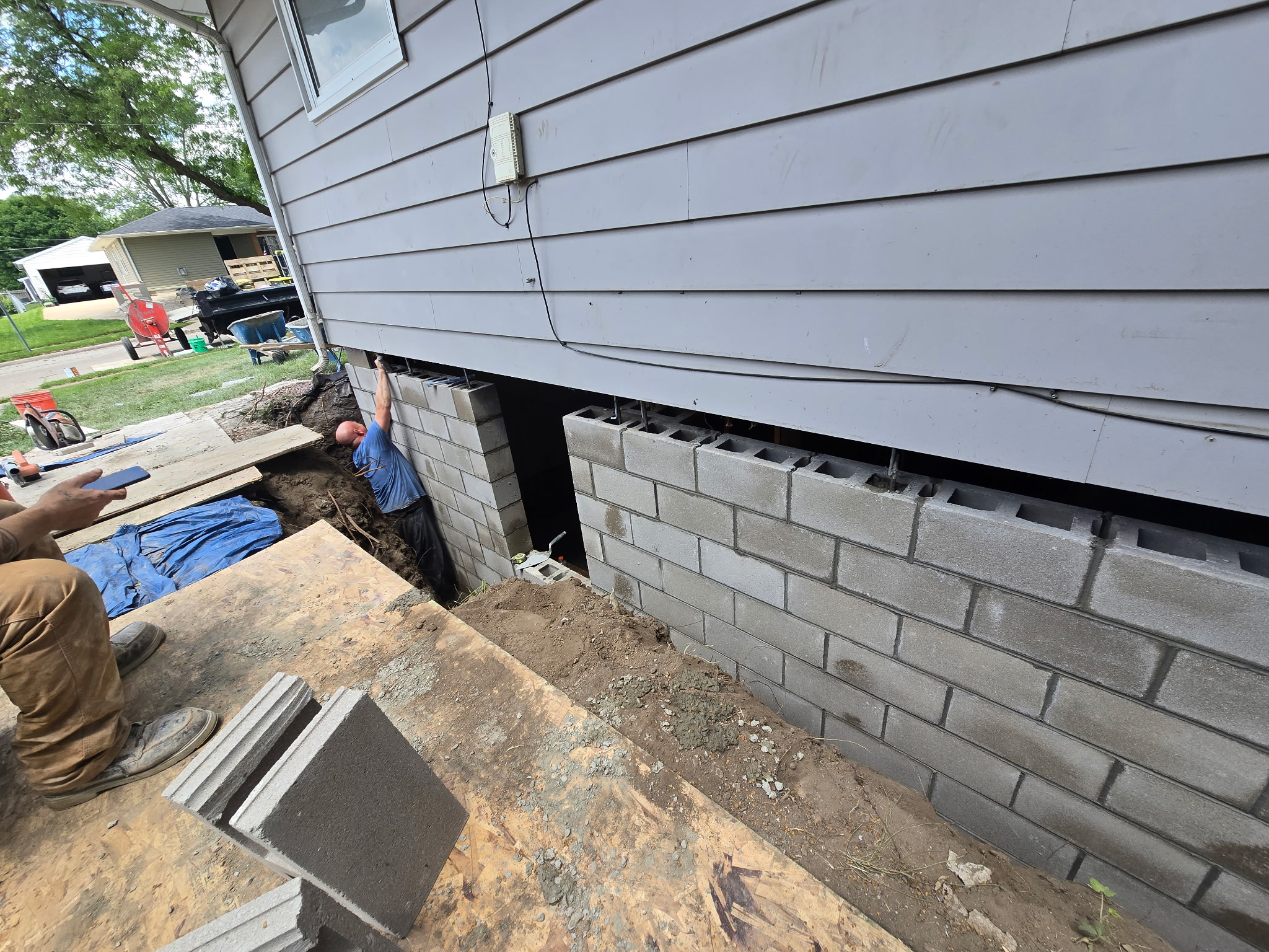 Behncke Construction rebuilding a failed foundation corner from the outside