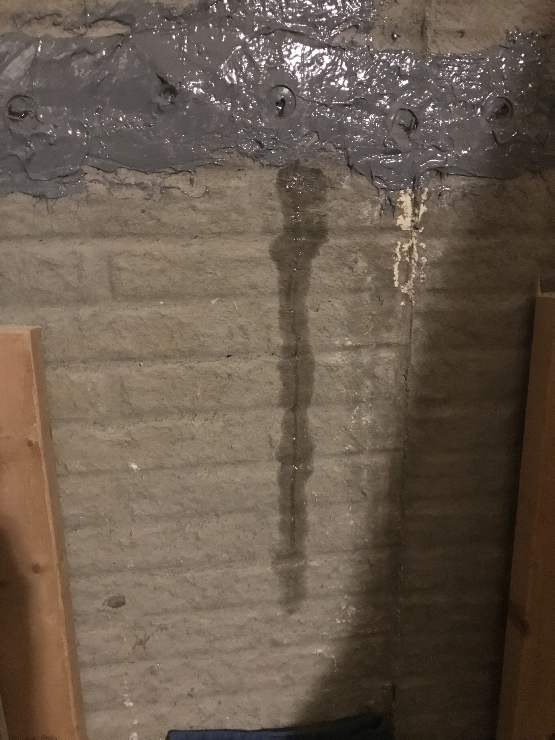 Horizontal and vertical cracking in a poured concrete foundation wall