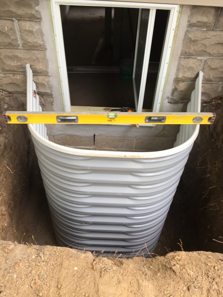 Egress window well — Behncke Construction