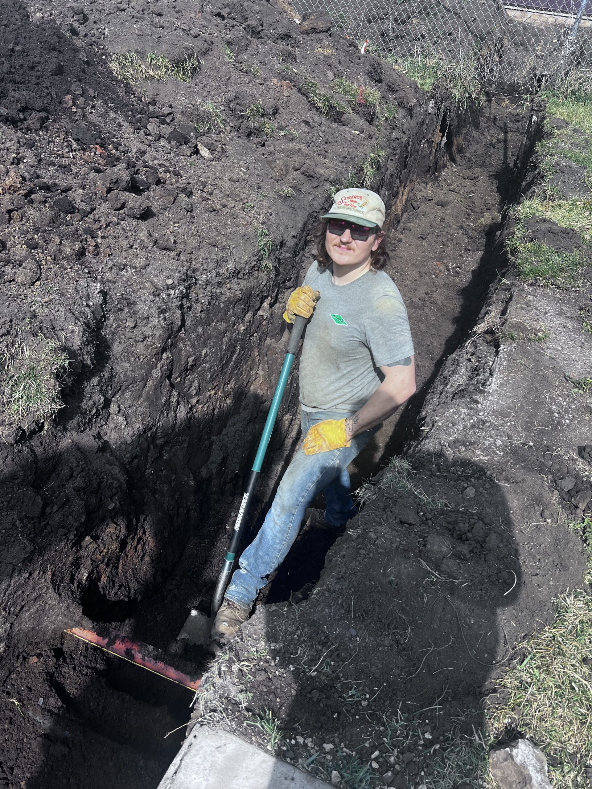 Excavating to correct drainage and keep water away from a foundation wall