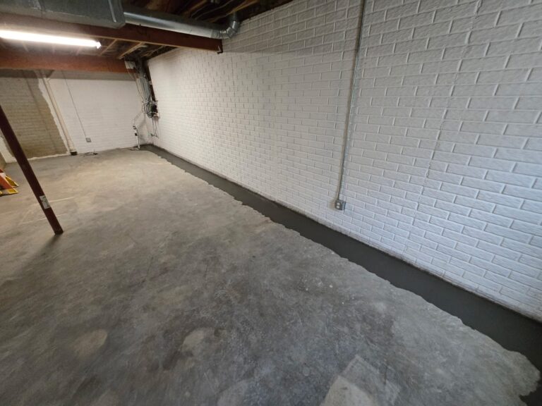 Completed cove joint and drain tile correction along basement wall — near Moline, IL