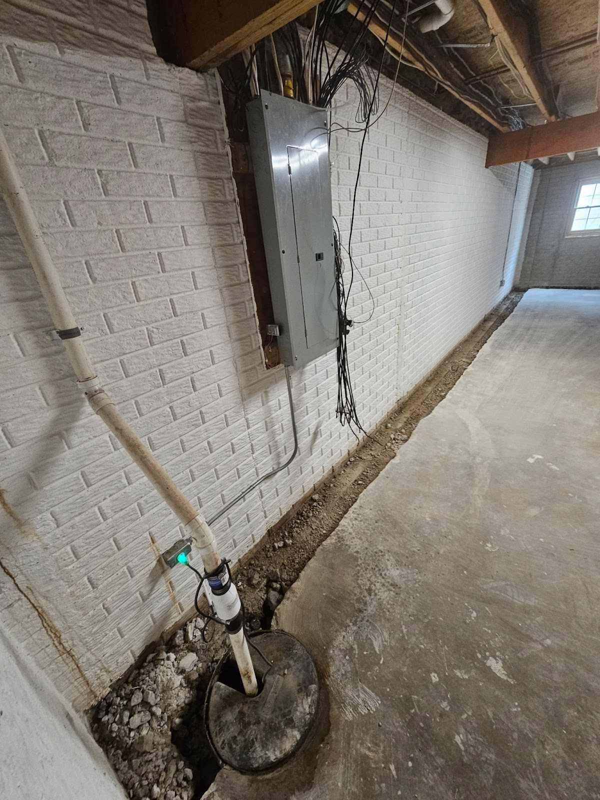 Basement waterproofing drain tile correction near Moline, IL — project photo 2