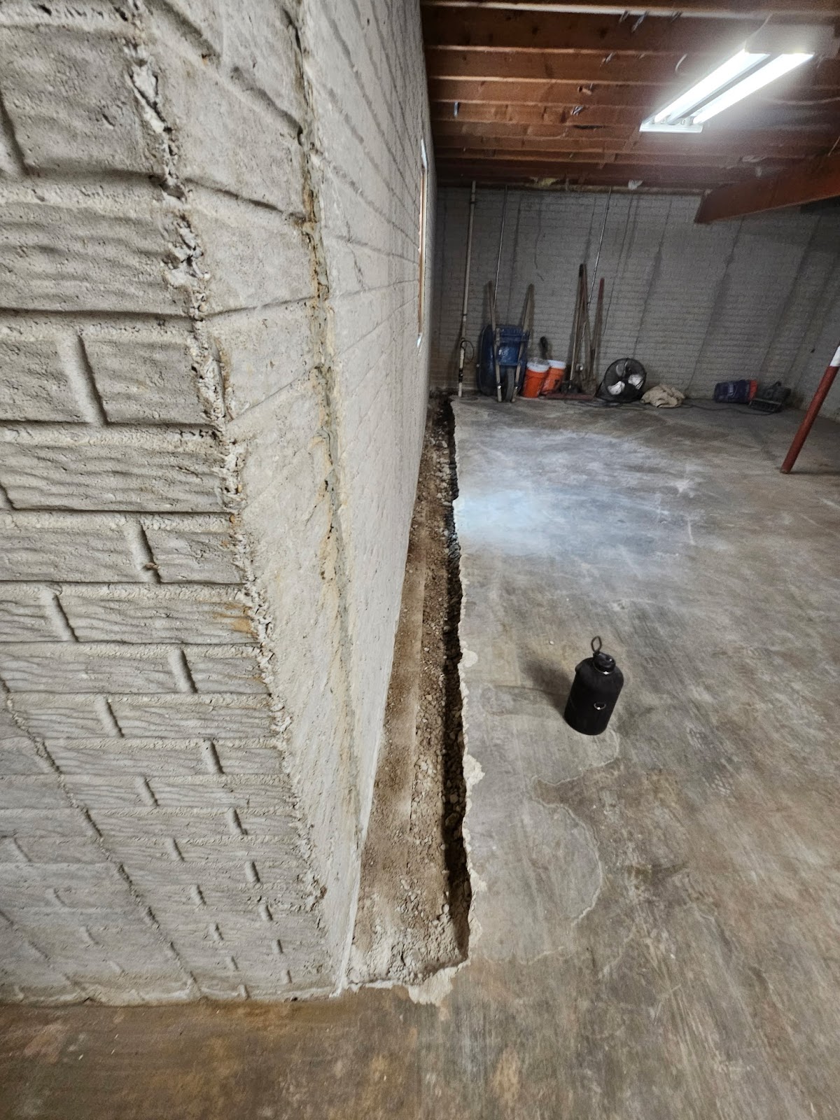 Basement waterproofing drain tile correction near Moline, IL — project photo 4