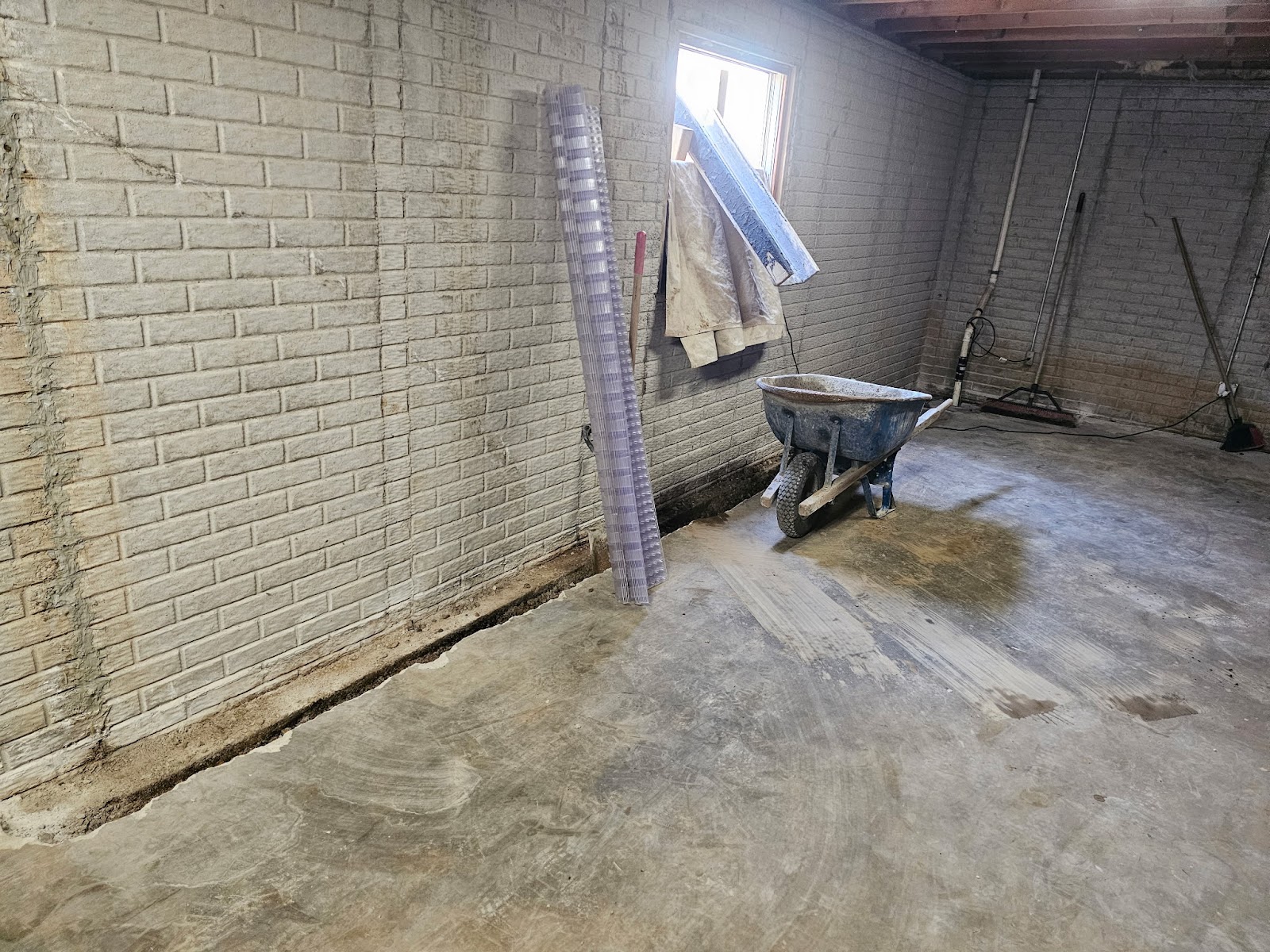 Basement waterproofing drain tile correction near Moline, IL — project photo 5