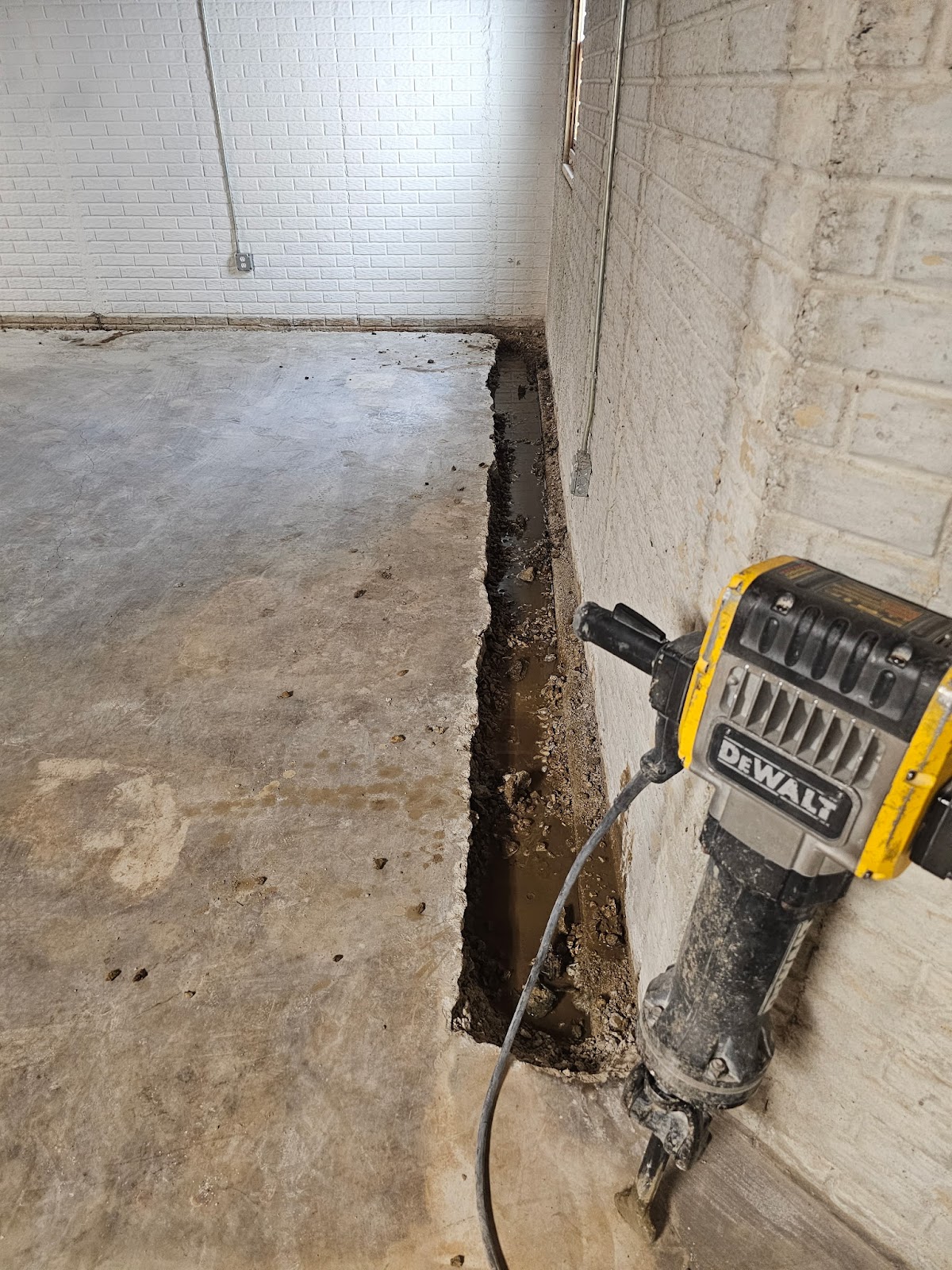 Basement waterproofing drain tile correction near Moline, IL — project photo 6