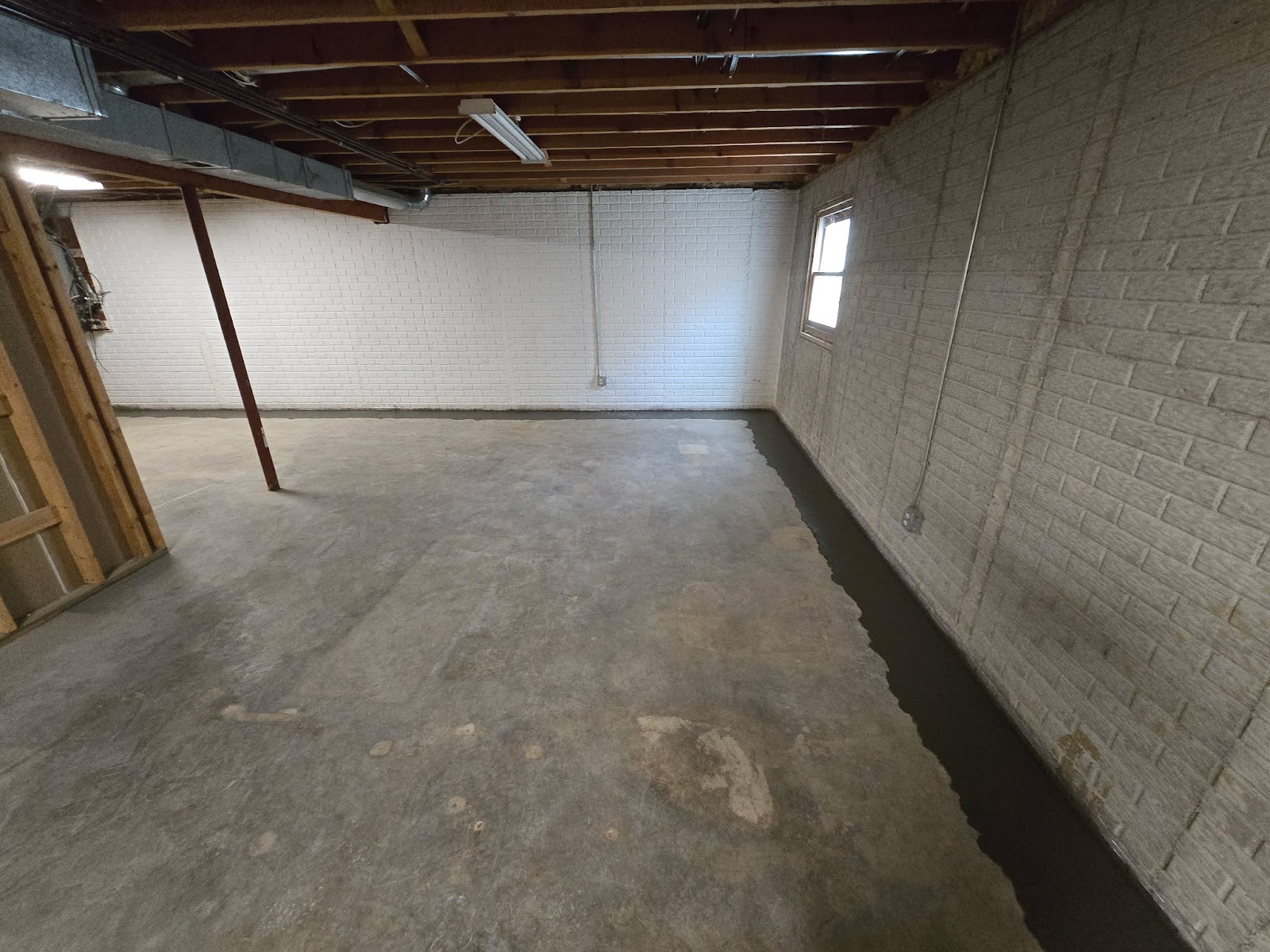 Basement waterproofing drain tile correction near Moline, IL — project photo 7