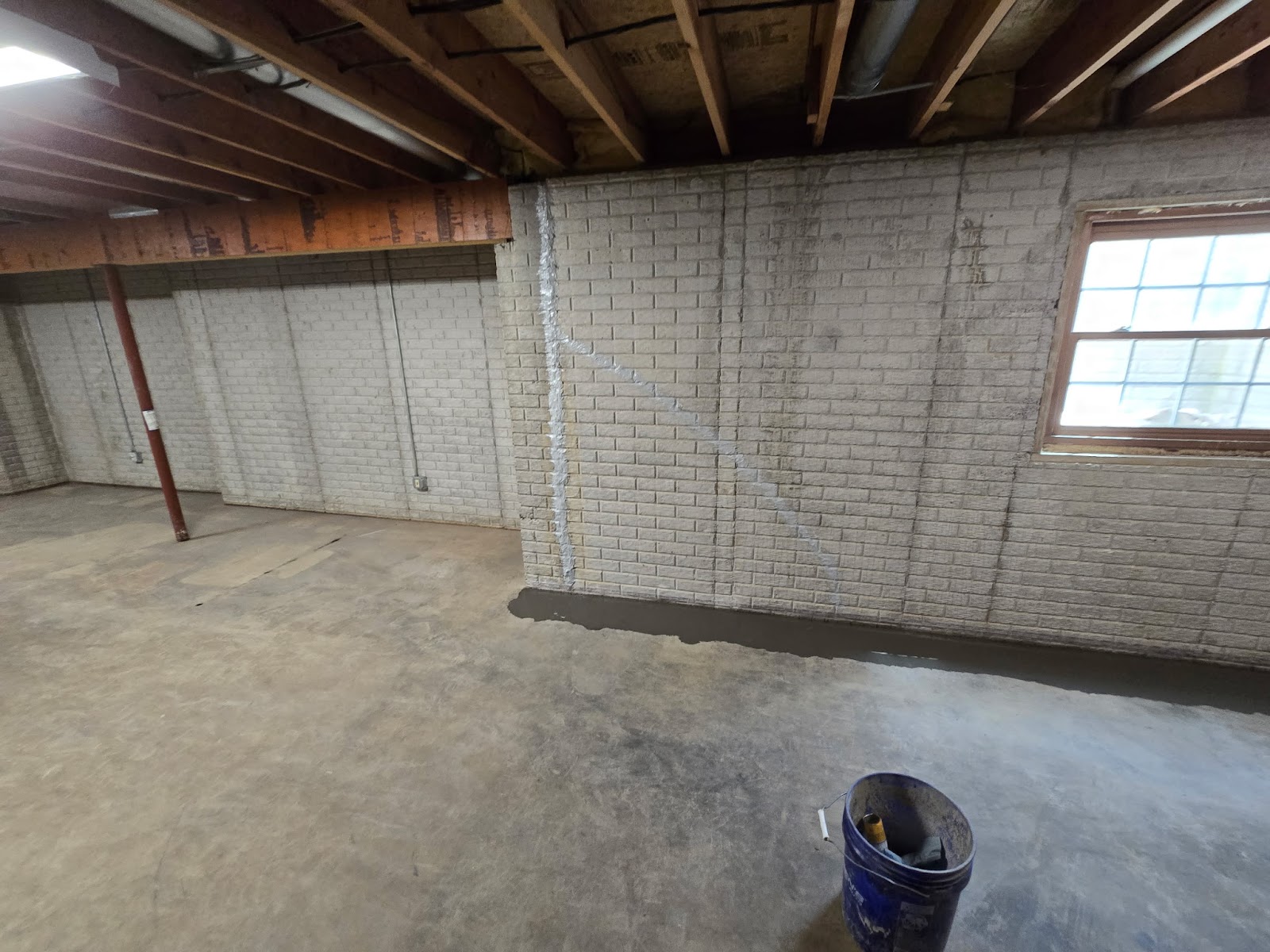 Basement waterproofing drain tile correction near Moline, IL — project photo 8