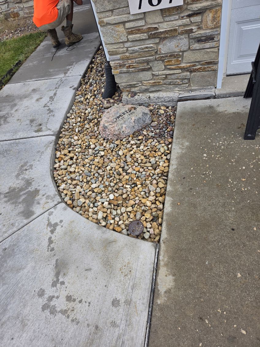 Repaired sidewalk section alongside a prepared gravel base