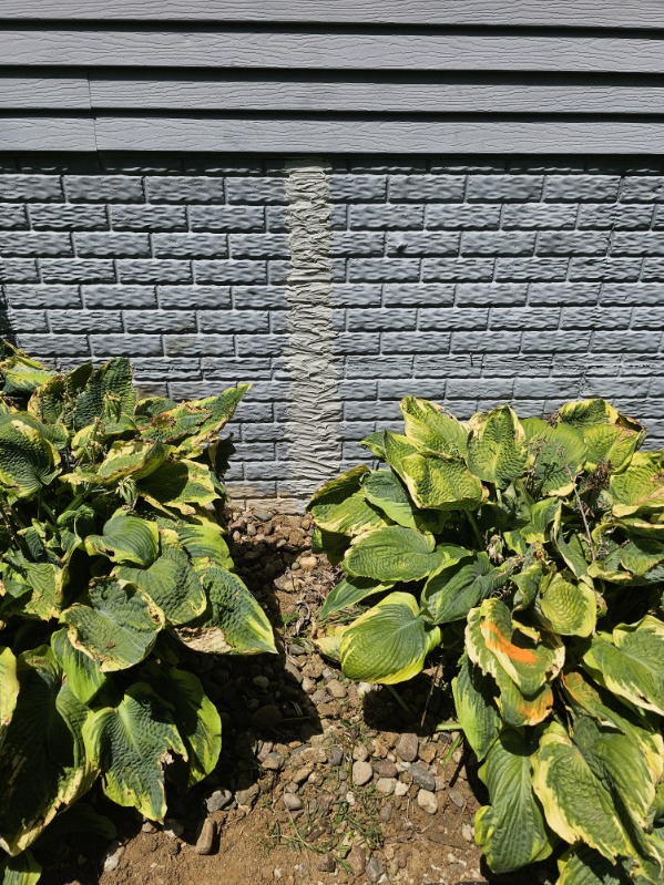 Completed foundation crack repair on poured concrete wall — Rock Island, IL