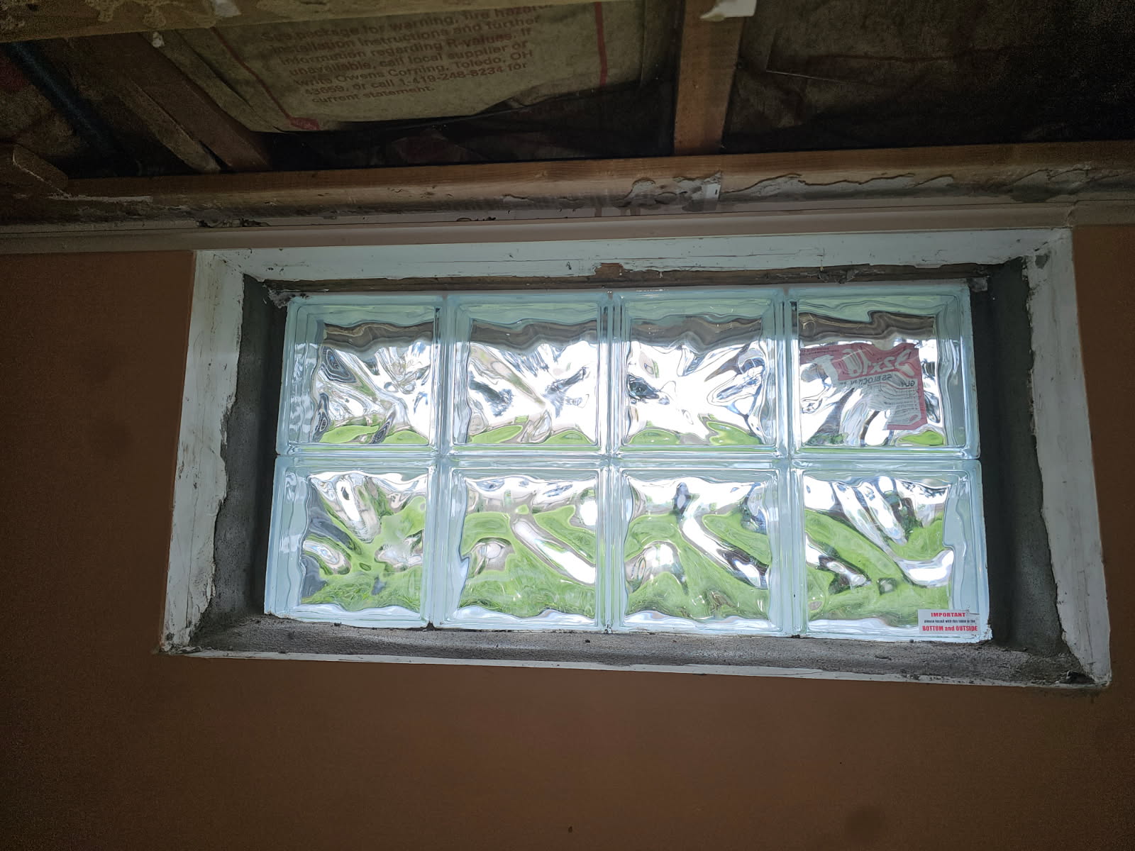 Interior view of the finished glass block basement window letting in natural light