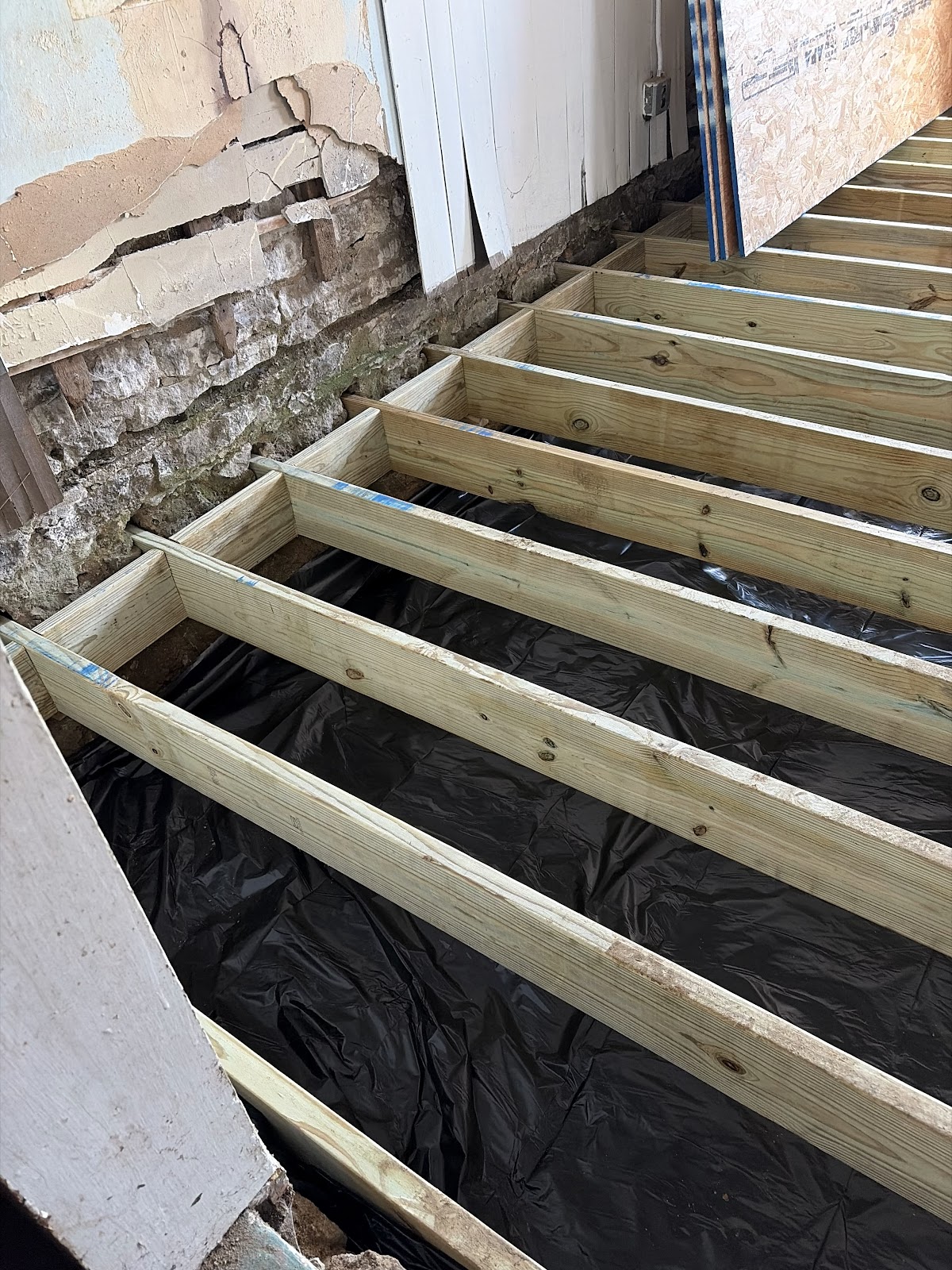Detail of the rebuilt floor framing in a Davenport, Iowa home