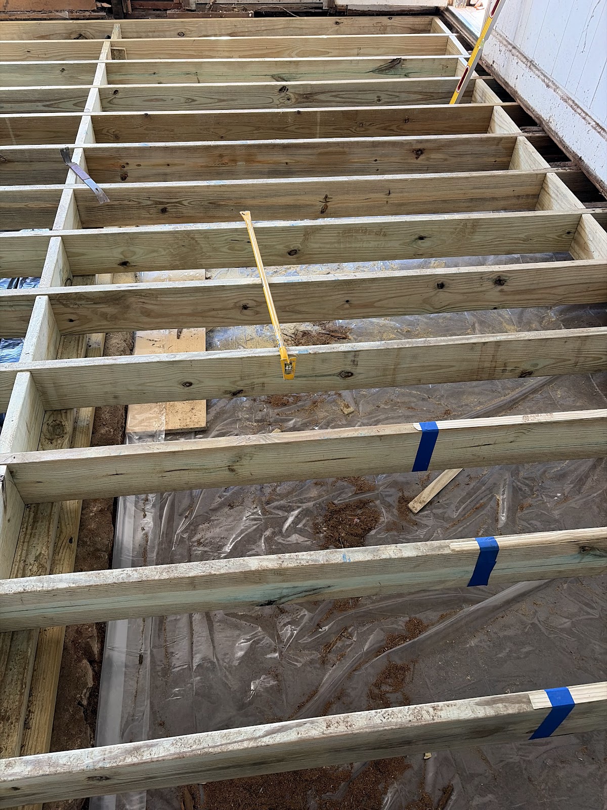 Detail of the new pressure-treated floor structure