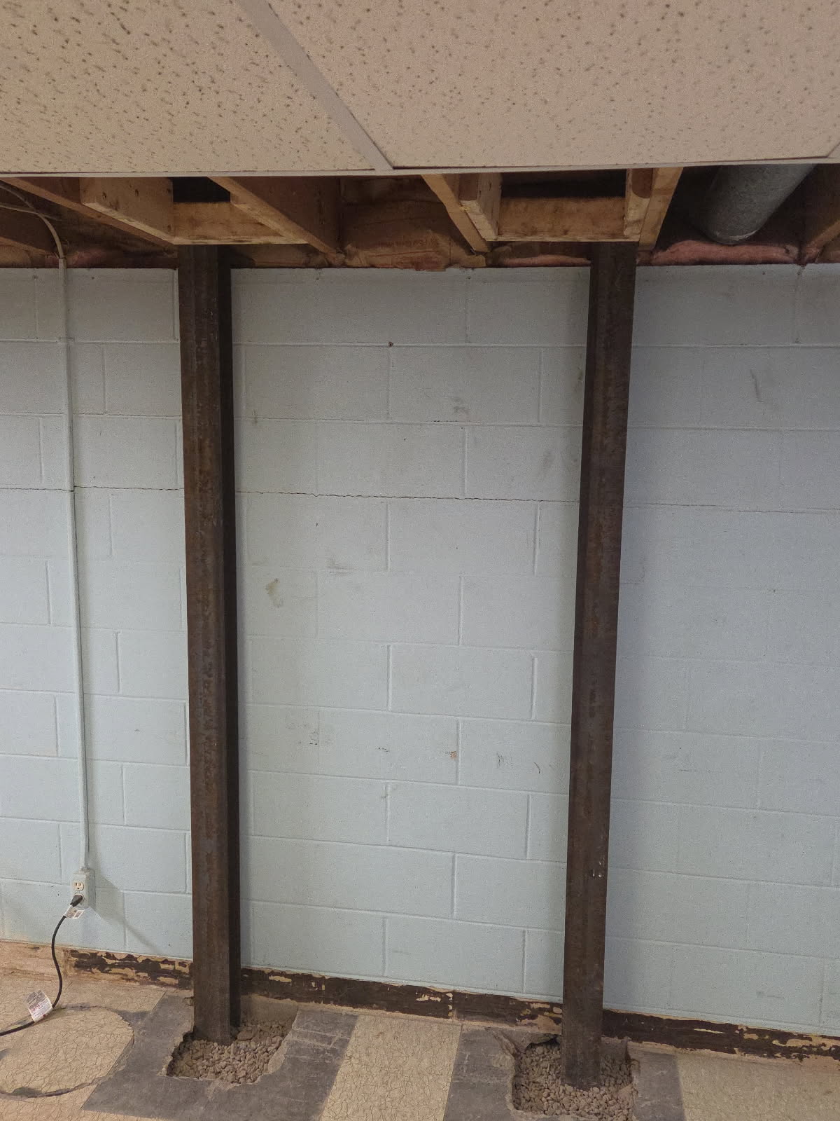 Detail of the steel I-beam bracing at the base of the wall