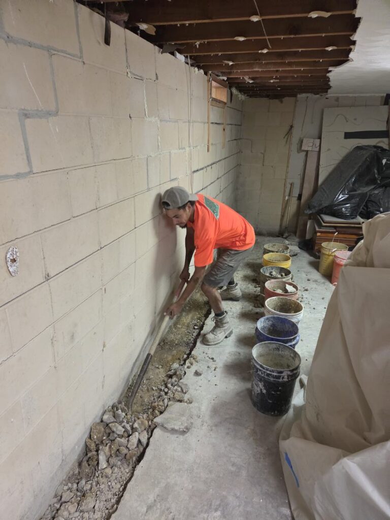 Foundation wall bracing, interior waterproofing and tuckpointing project in Davenport, IA — photo 11 of 19