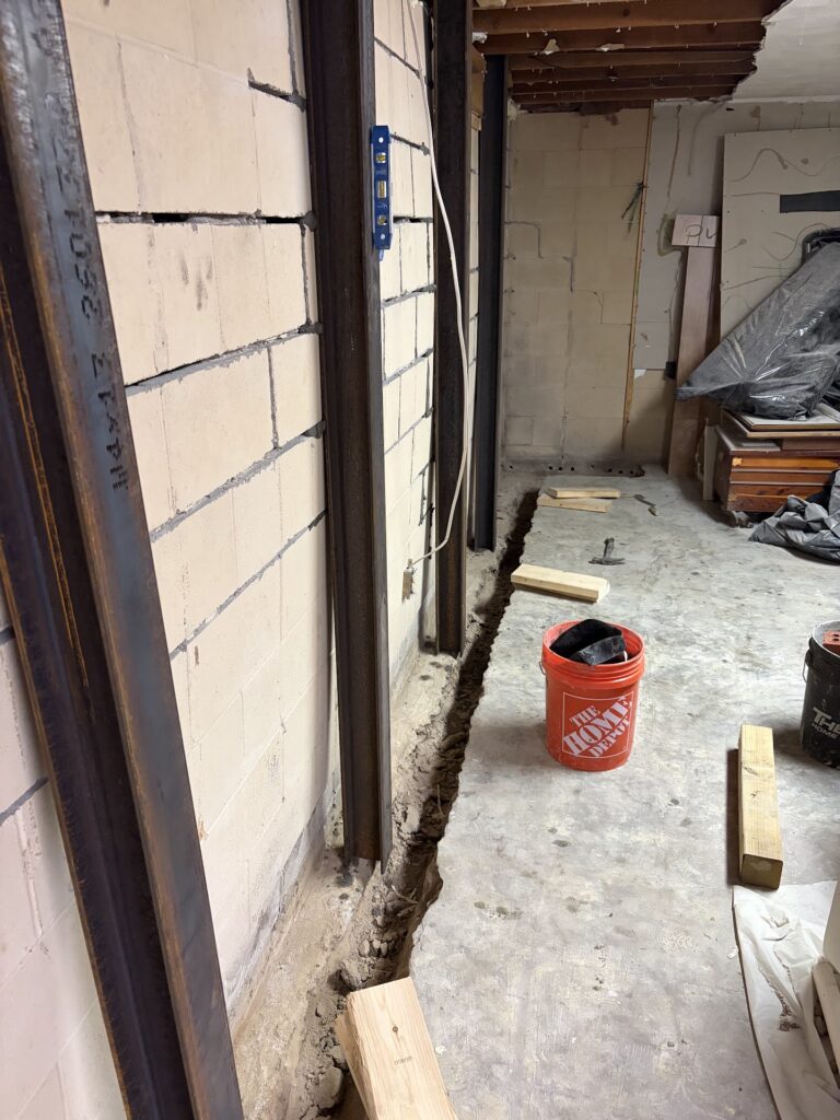 Foundation wall bracing, interior waterproofing and tuckpointing project in Davenport, IA — photo 12 of 19