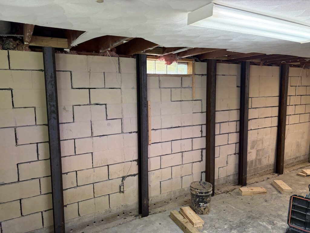 Foundation wall bracing, interior waterproofing and tuckpointing project in Davenport, IA — photo 13 of 19