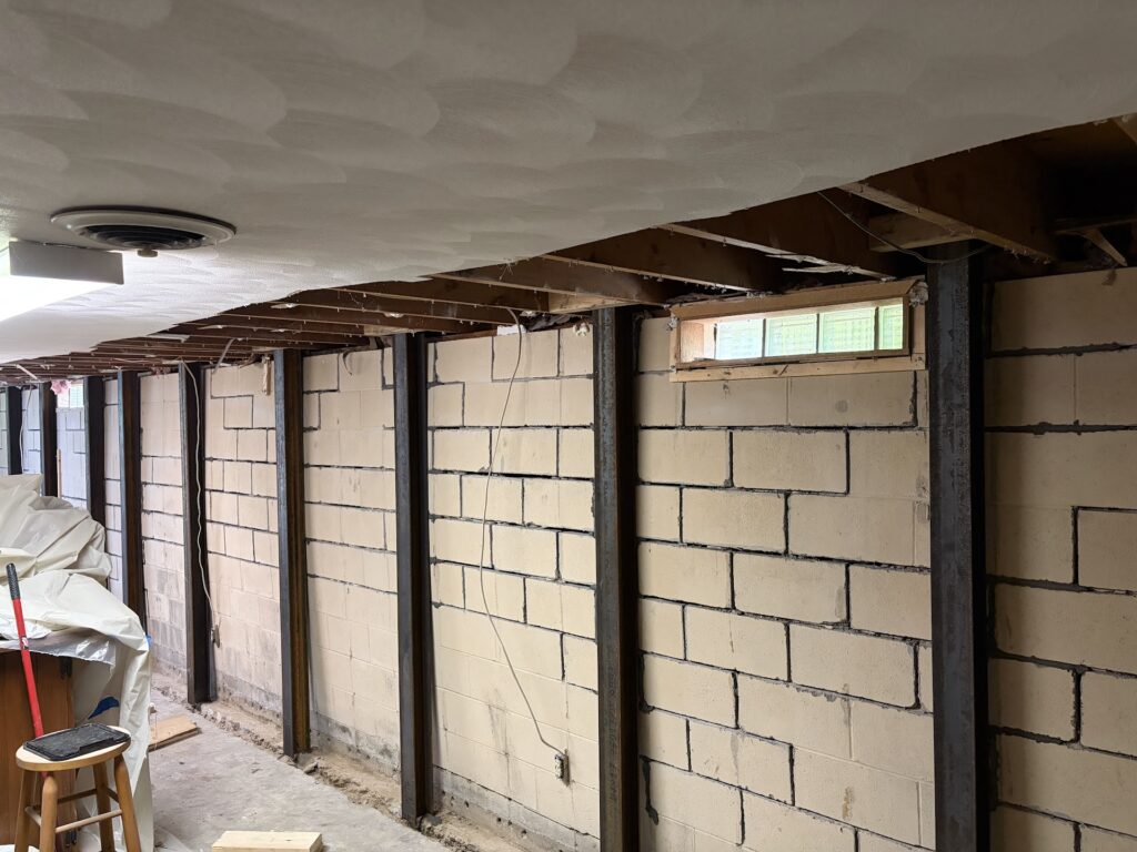 Foundation wall bracing, interior waterproofing and tuckpointing project in Davenport, IA — photo 14 of 19