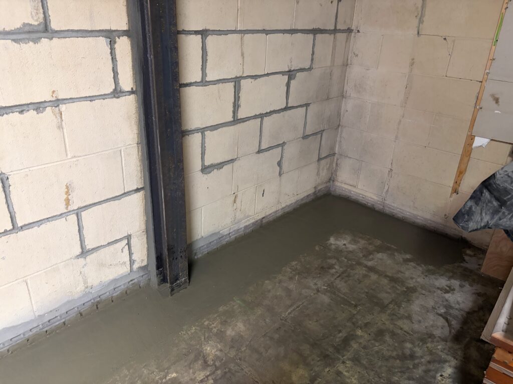 Foundation wall bracing, interior waterproofing and tuckpointing project in Davenport, IA — photo 17 of 19