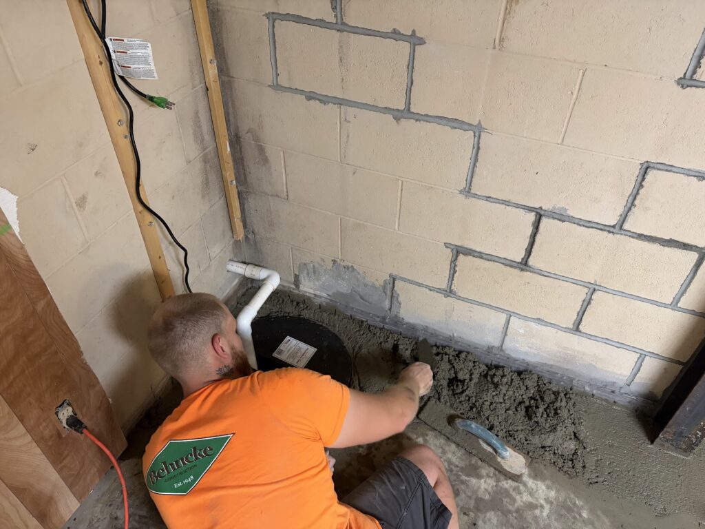 Foundation wall bracing, interior waterproofing and tuckpointing project in Davenport, IA — photo 18 of 19