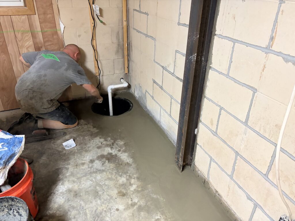 Foundation wall bracing, interior waterproofing and tuckpointing project in Davenport, IA — photo 19 of 19