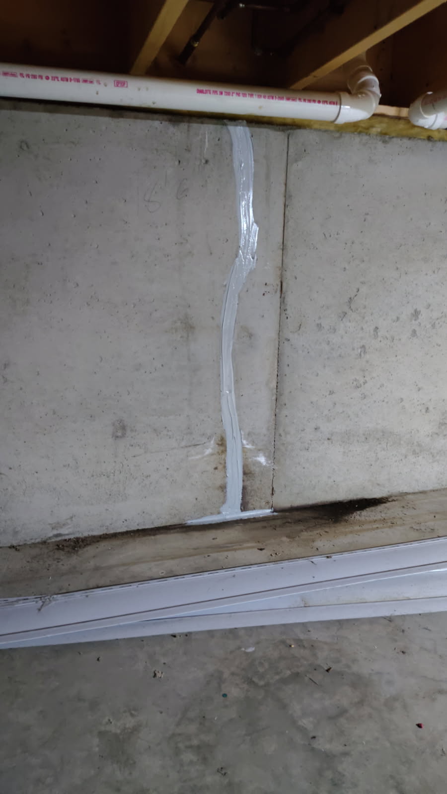 Completed foundation crack repair sealed on the inside face of the basement wall