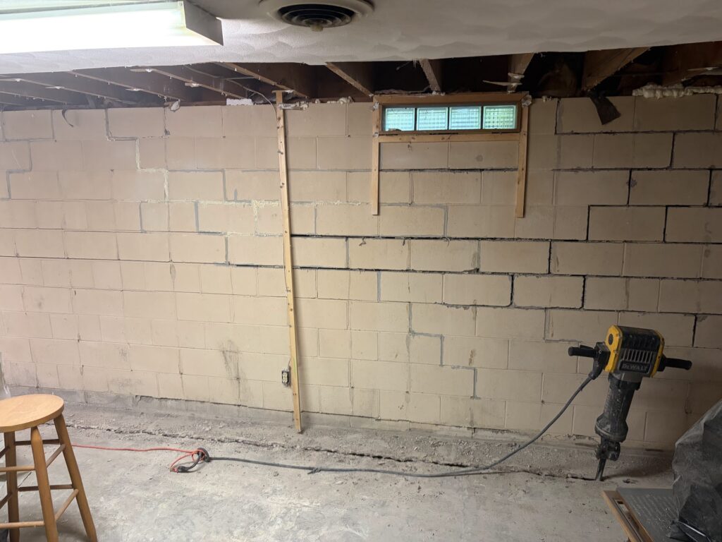 Foundation wall bracing, interior waterproofing and tuckpointing project in Davenport, IA — photo 5 of 19
