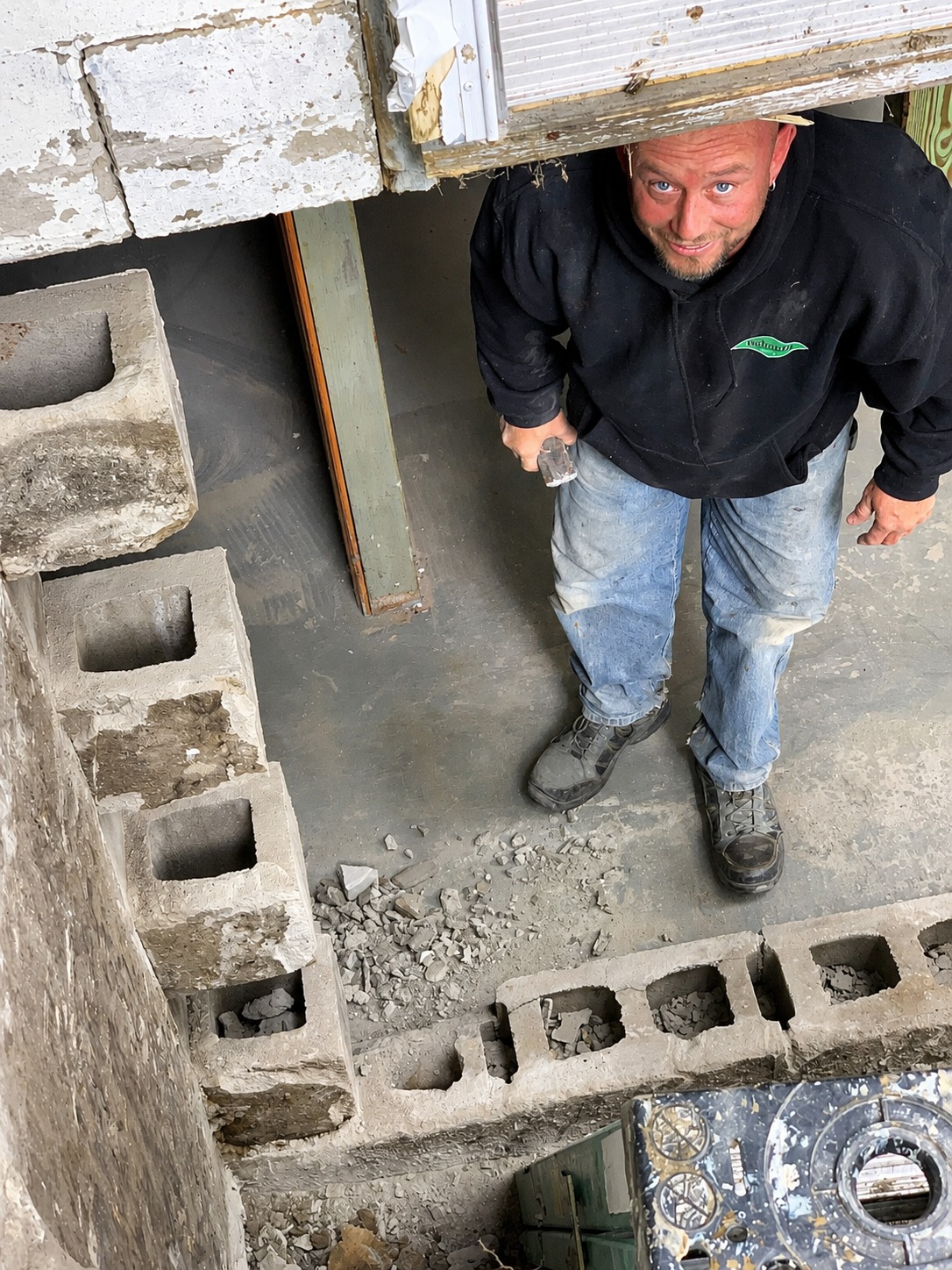 Behncke crew member working under a Quad Cities home