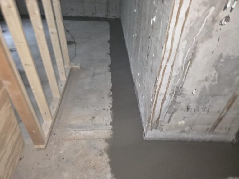 Finished interior drain tile and dual sump pit basement waterproofing system in Blue Grass, Iowa