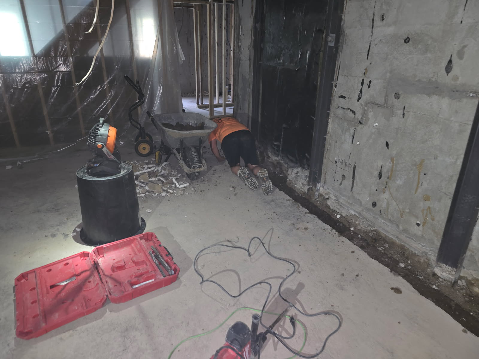 Interior basement waterproofing work in progress in Blue Grass, Iowa