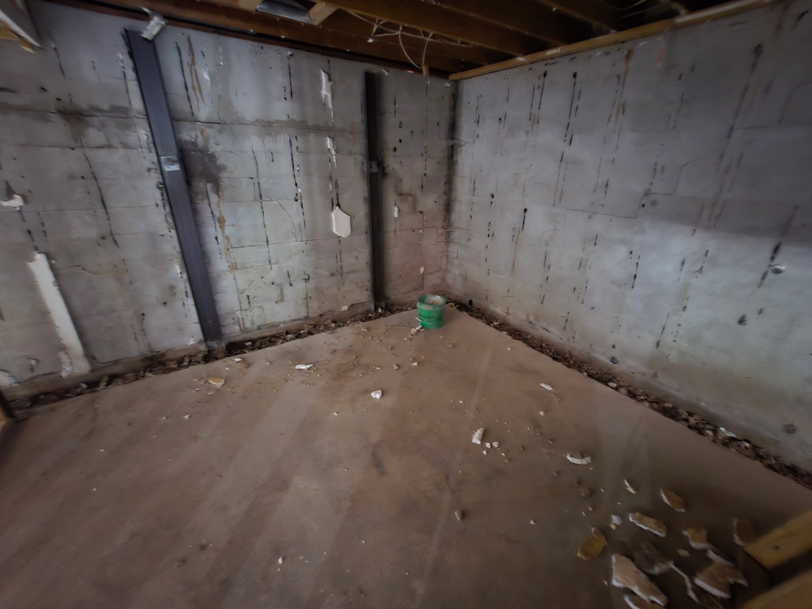 Basement before waterproofing in Blue Grass, Iowa