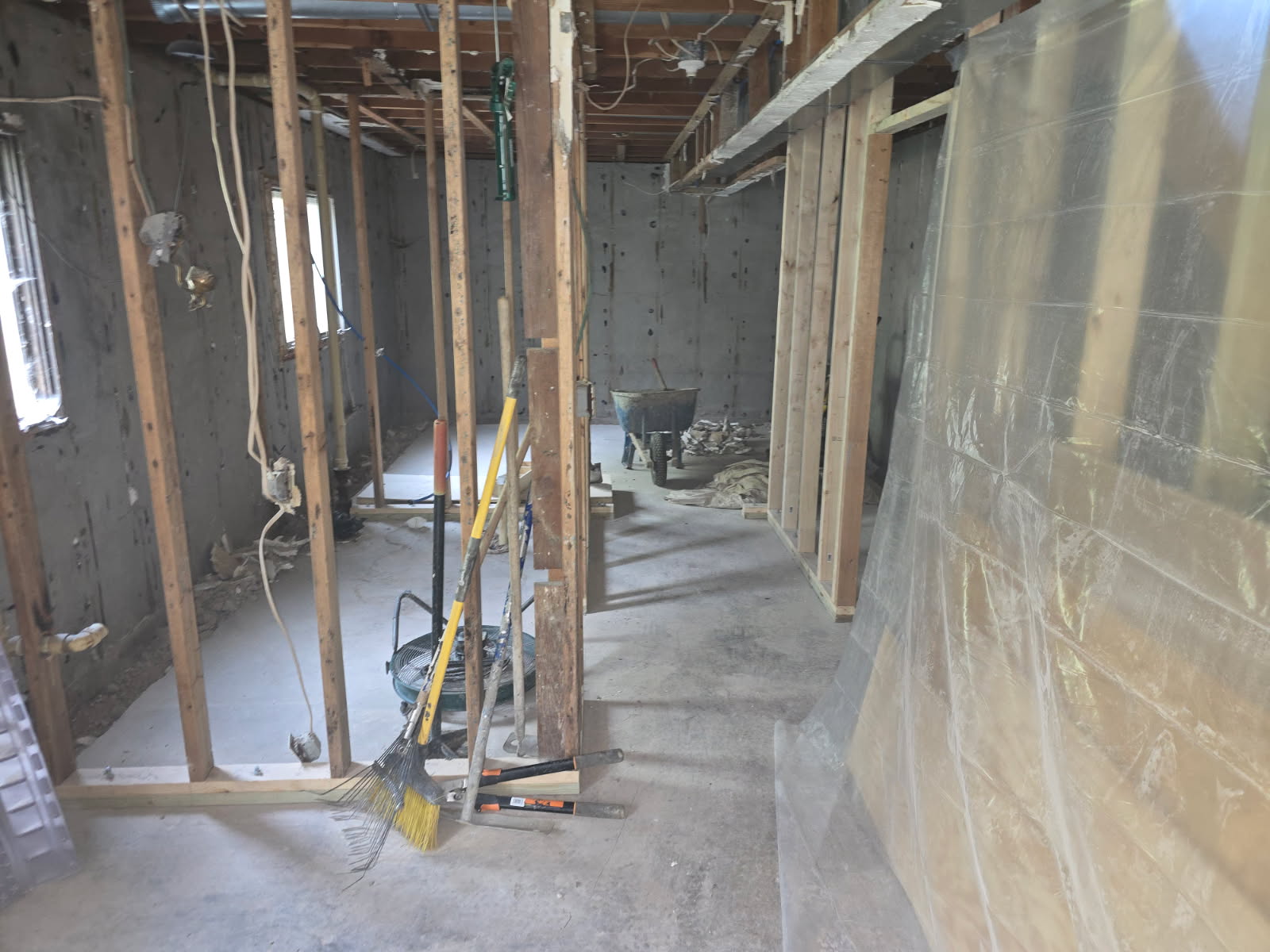 Interior perimeter drain tile along the foundation in a Blue Grass, Iowa basement