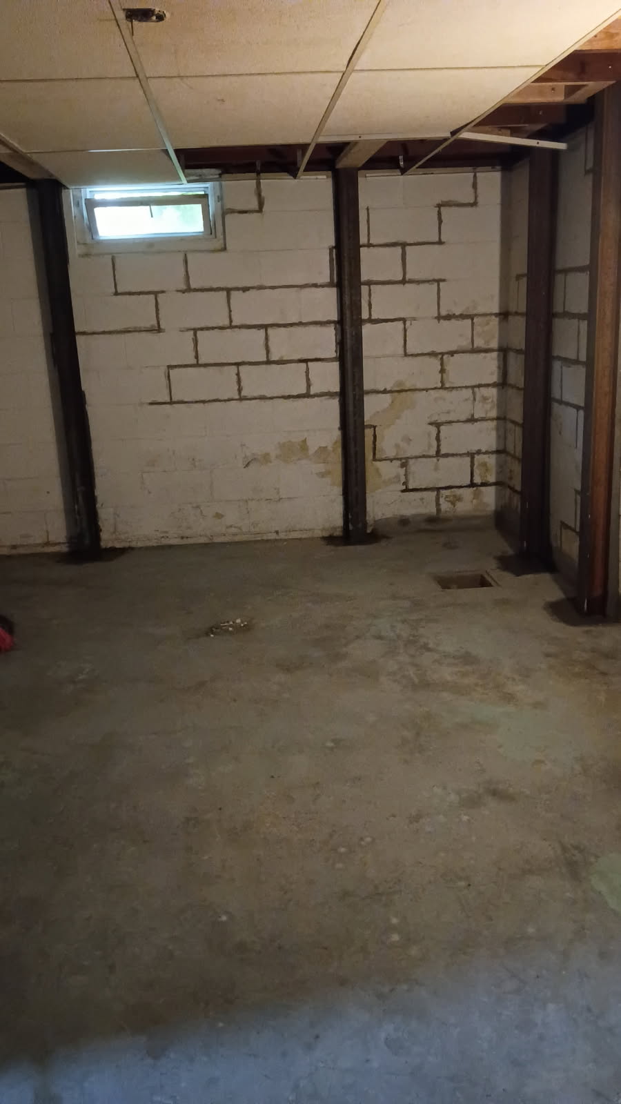 Braced block walls at a basement corner after the stabilization work