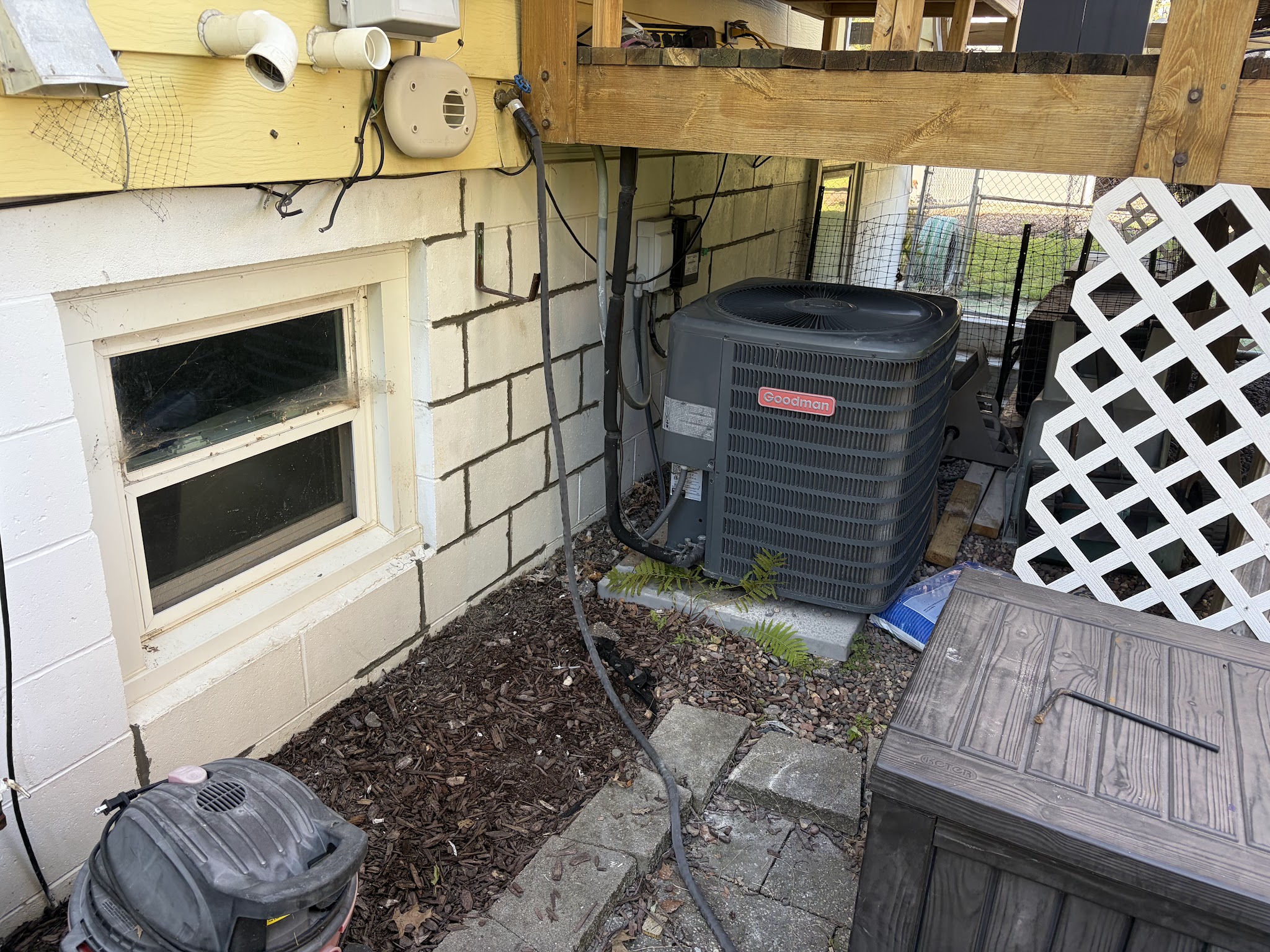 Downspout and foundation corner where drainage was improved