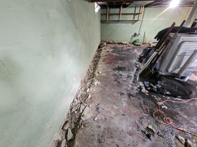 Bettendorf basement during the waterproofing and foundation wall stabilization project