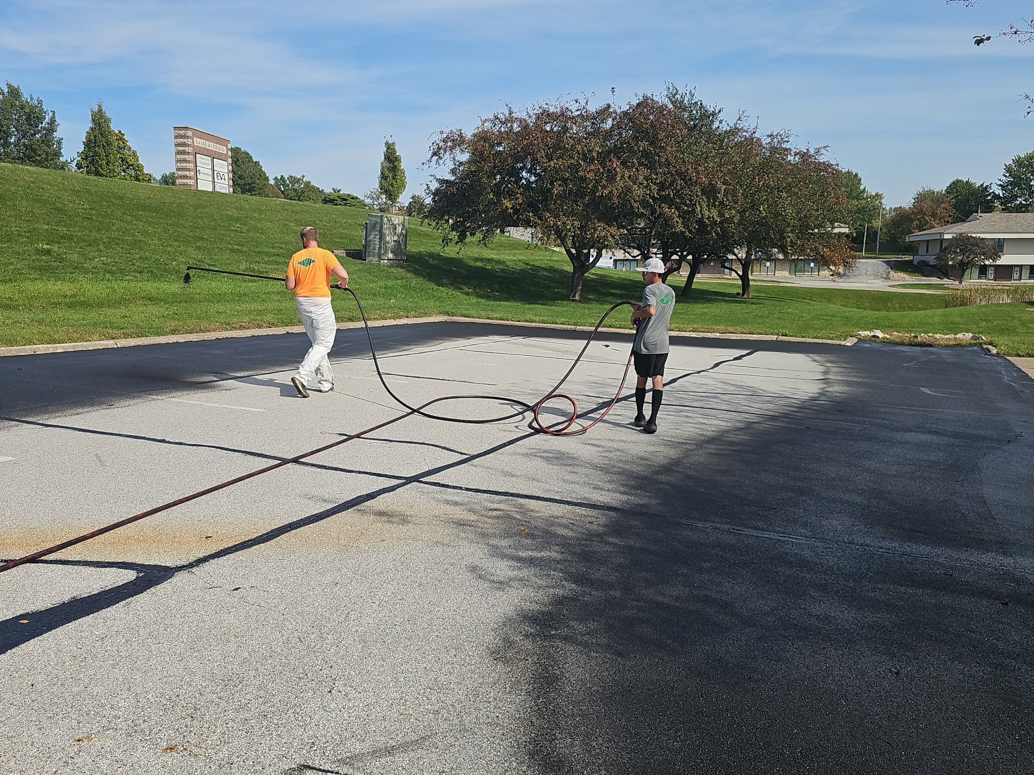 Parking lot at Keller Williams in Bettendorf during the crack filling and sealcoating project