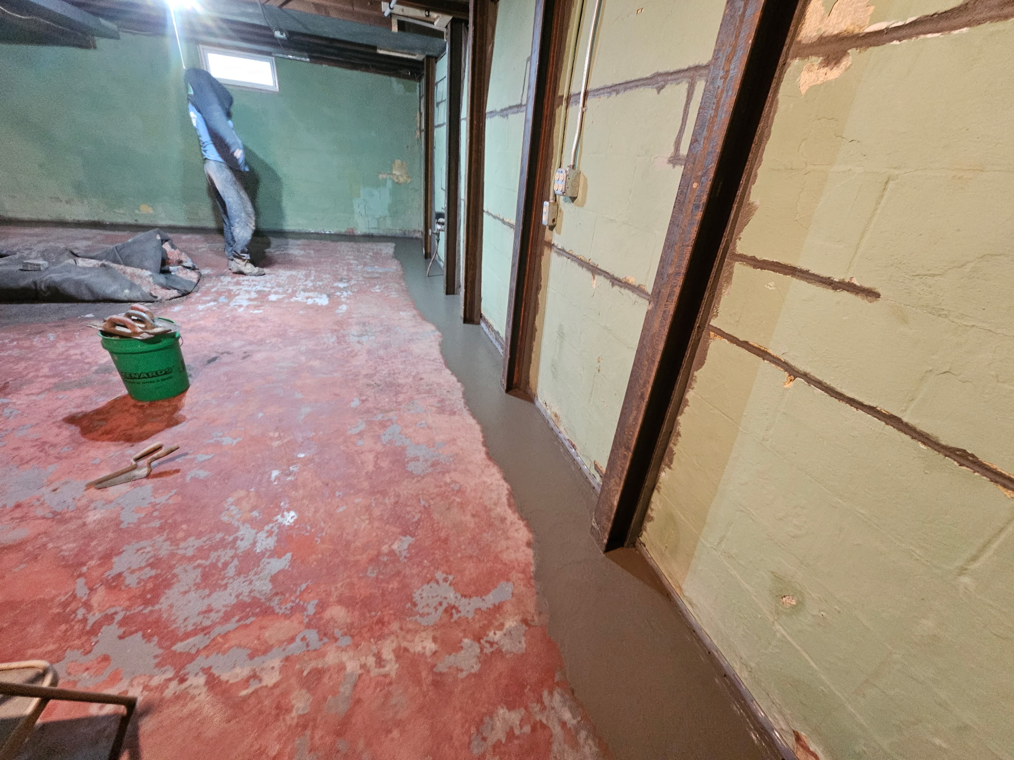 Bettendorf basement during the waterproofing and foundation wall stabilization project