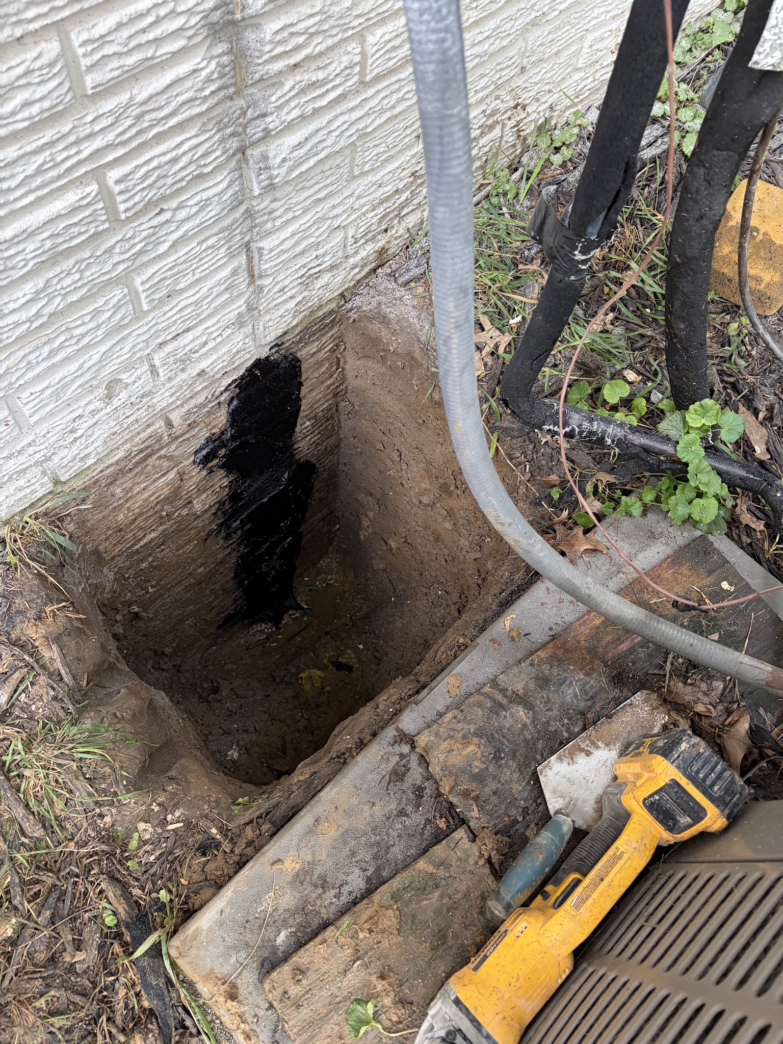 Exterior excavation down the foundation wall at the crack