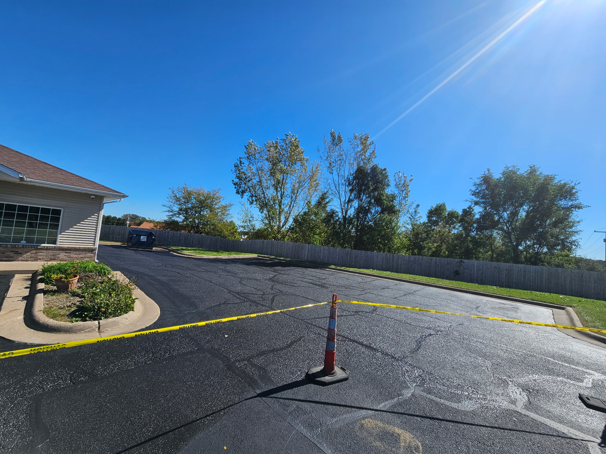 Commercial parking lot in Davenport during the sealcoating and crack-filling project