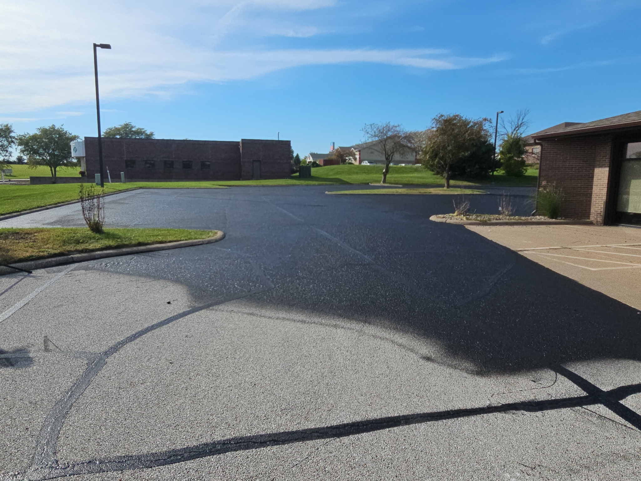 Parking lot at Keller Williams in Bettendorf during the crack filling and sealcoating project