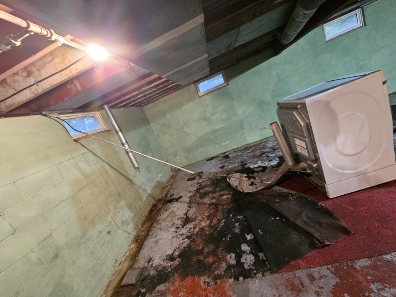 Bettendorf basement during the waterproofing and foundation wall stabilization project